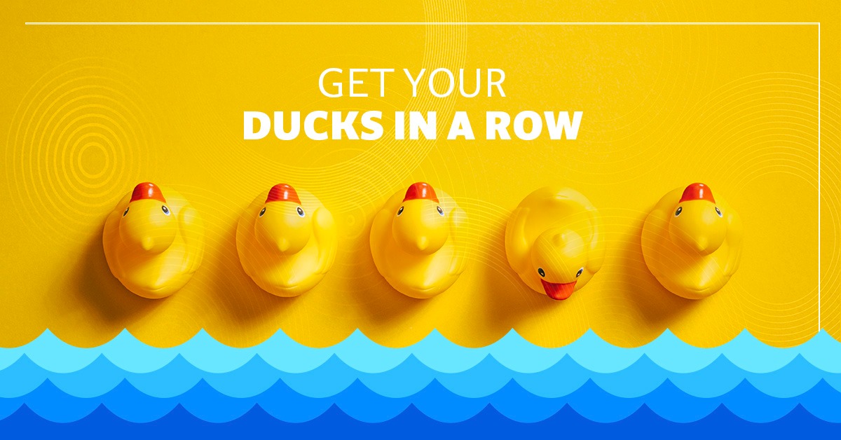 Yellow background with overlayed text. Yellow ducks